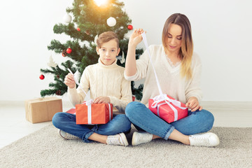 Wall Mural - Single parent and holidays concept - Portrait of mother celebrating christmas at home on christmas eve