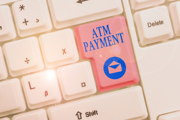 Word writing text Atm Payment. Business photo showcasing Cashless Payment made through portable electronic devices White pc keyboard with empty note paper above white background key copy space