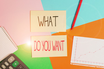 Text sign showing What Do You Want. Business photo showcasing used for offering something to someone or asking their need Office appliance colorful square desk study supplies empty paper sticker