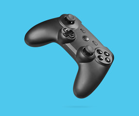 Wall Mural - game controller isolated on blue background