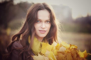 Poster - Outdoors portrait of a pretty woman in the autumn park