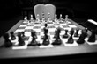 © MoiraM - Monochrome shallow depth of field (selective focus) image with wooden chess pieces on a wooden table before a professional competition.