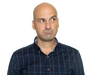 Studio portrait of a bald guy is thinking looking up