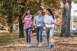 © BalanceFormCreative - up of female friends jogging at the city park.Relaxing after running and making fun.Autumn season.