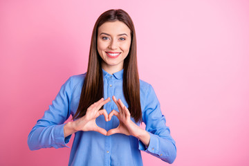 Wall Mural - Photo of pretty lady showing heart symbol with arms creative prom invitation for boyfriend wear blue dotted shirt isolated pink color background