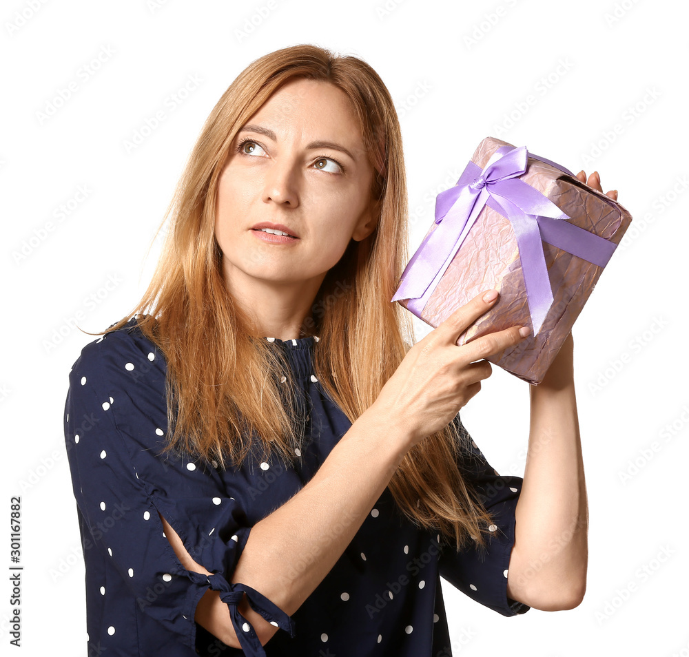 Beautiful woman with gift on white background