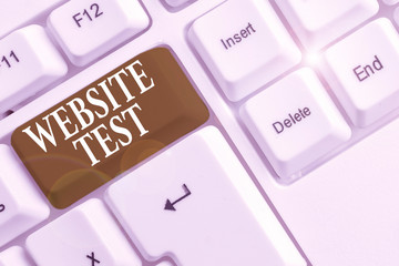 Text sign showing Website Test. Business photo text test the websites or web applications for potential bugs White pc keyboard with empty note paper above white background key copy space
