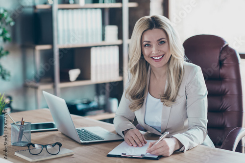 Cuadros en Lienzo Photo of amazing blond business lady notebook table signing contract important p