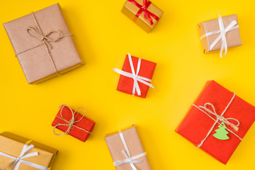Wall Mural - Top above high angle photo of christmas tradition new year celebration gift boxes flatlay overhead isolated over red yellow color background