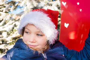 Canvas Print - portrait of a beautiful young man in the sleigh of Santa Claus