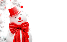 White Snowman With Red Bowtie And Hat On White Background For Copy Space