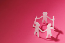 Paper Cut Style Concept Of A Leader And Relationship With Friendship And Hand-holding Of People In Symbolic Form On Inspiration Style And Modern Pink Paste Background - 3D Rendering