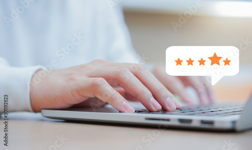 Cuadros en Lienzo close up on customer man hand typing on keyboard laptop to giving good score poi