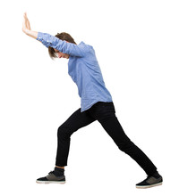 Determined Teenage Guy Making Effort As Pushing An Heavy Invisible Object Isolated On White Background. Confident Boy, Difficult Task Concept, Convinced In His Powers, Finding Solutions To Problems.