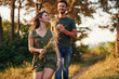 © standret - Having fun. Beautiful young couple have a good time in the forest at daytime