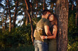 © standret - Beautiful young couple have a good time in the forest at daytime