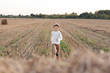 © Ekaterina Yakunina/Westend61 - Smiling boy running over a stubble field