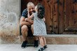 © gemma ferrando & jeremie roman/Westend61 - Little girl kissing her father outdoors, Mallorca, Spain