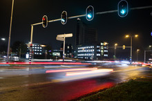 Intersection At Night With Traffic Lights And Traffic Blurred By Motion In Arnhem, Netherlands