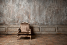 Old Armchair Against A Vintage Wall