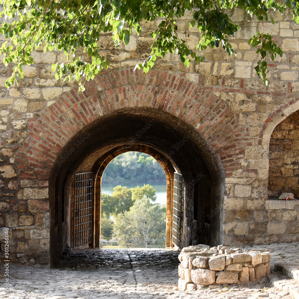 Obraz na płótnie view through one of the gates, made in brick and stone wall, on Kalemegdan fortress, Belgrade, Serbia  w salonie