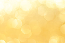 Gold,yellow Abstract Light Background, Gold  Bokeh Shining Lights, Sparkling Glittering Christmas Lights.Season Greeting Background.New Year Luxury Backdrop Image.Blurred Abstract Holiday Background.