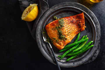 Wall Mural - Closeup of baked salmon fish with green beans