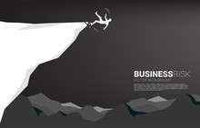 Silhouette Of Businessman Slip And Falling Down From The Cliff. Concept For Fail And Accidental Business
