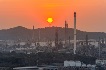 The sunset scene of the petrochemical industry refinery at sunset time