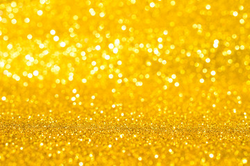 sparkles of golden glitter texture background	