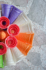 Wall Mural - colourful bread rafts outside a bakery in thailand. the loafs will carry a candle, incense and other