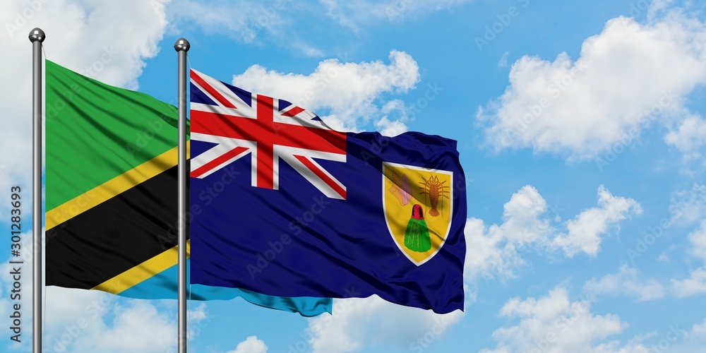 Tanzania and Turks And Caicos Islands flag waving in the wind against ...