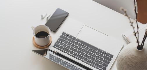 Canvas Print - close-up view of modern workspace with laptop computer and office supplies