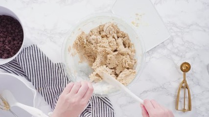 Sticker - Step by step. Flat lay. Mixing ingredients in a glass bowl to make chocolate chip cookies.