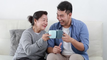 Wall Mural - Asian mother and son lifestyle in living room