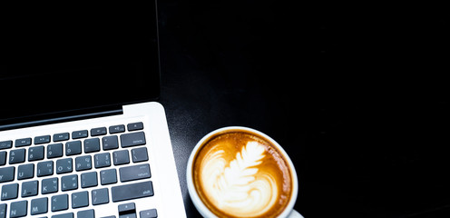 Cup of coffee latte isolated on black background