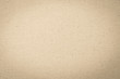 Hessian sackcloth woven texture pattern background in light yellow cream brown
