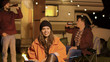 © DC Studio - Girl sitting on a camping chair in a cold night of autumn