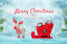 Merry Christmas Greeting Card With Cute Toy Of Santa's Reindeer Sleigh Full Of Gifts In Snow.