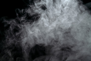 Wall Mural - Abstract powder or smoke effect isolated on black background