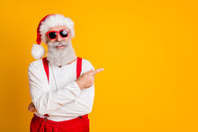 2020 Christmas Resolution Discounts. Funny Funky Grey Hair Santa Claus In Red Hat Point Index Finger Indicate X-mas Time Sales Isolated Over Yellow Color Background