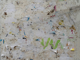 Old street notice board with leftover paper as a background for design work.