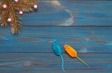 New Year's composition. Two mice on a blue wooden background. The rat is a symbol of the year. Christmas, winter, new 2020 year concept. Flat lay. Top view and copy space.