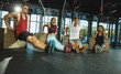 © master1305 - A group of muscular athletes doing workout at the gym. Gymnastics, training, fitness workout flexibility. Active and healthy lifestyle, youth, bodybuilding. Training with sportive jump boxes.