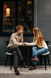 © Виктория Карлова - Portrait of a young couple in love in a cafe