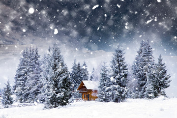 Wooden cottage in a fairy-tale winter landscape.