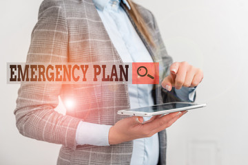 Text sign showing Emergency Plan. Business photo showcasing procedures for handling sudden or unexpected situations Business concept with mobile phone and business woman