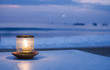 Candle on the background of the ocean
