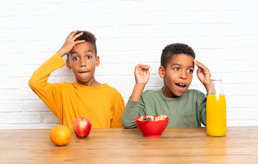 Poster - African American brothers having breakfast and doing surprise gesture