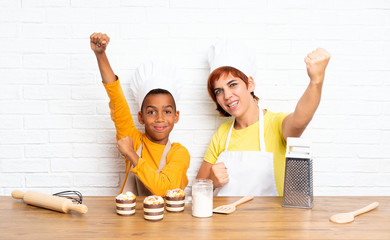 Poster - Lucky Mother and her son dressed as chef in a kitchen